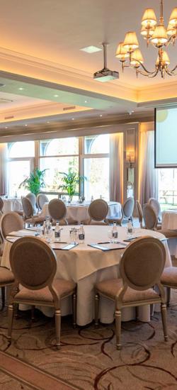 Ballyhannon Suite at The Rine Hotel (formerly The Inn at Dromoland), featuring elegant chandeliers and large windows
