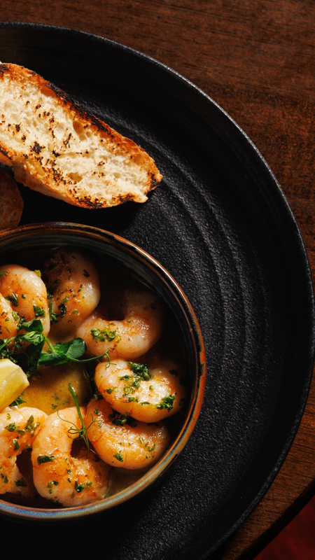 a classic Spanish-style tapas dish of sizzling chili and garlic prawns in Co Clare, Ireland