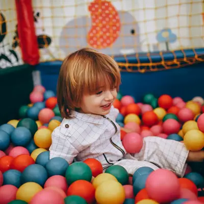 a kid playing in a vibrant, indoor ball pit Co Clare, Ireland