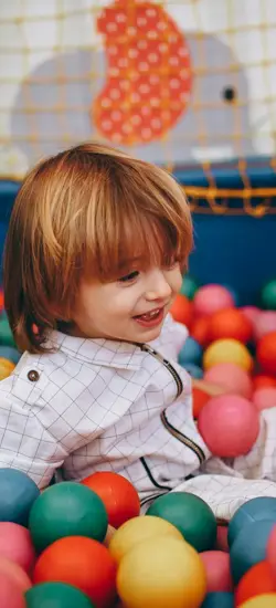 a kid playing in a vibrant, indoor ball pit Co Clare, Ireland