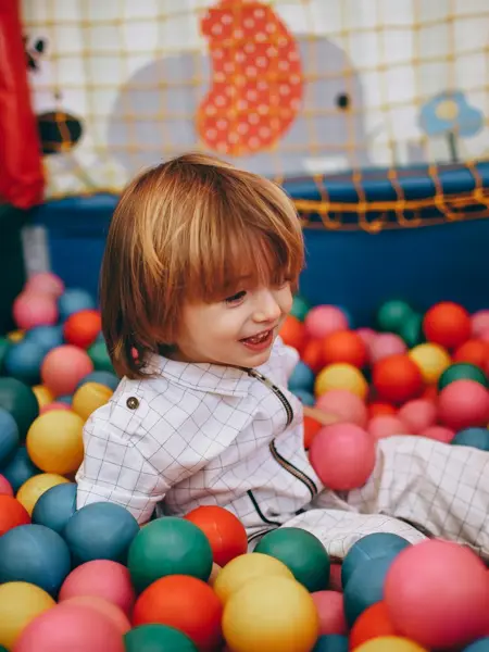 a kid playing in a vibrant, indoor ball pit Co Clare, Ireland