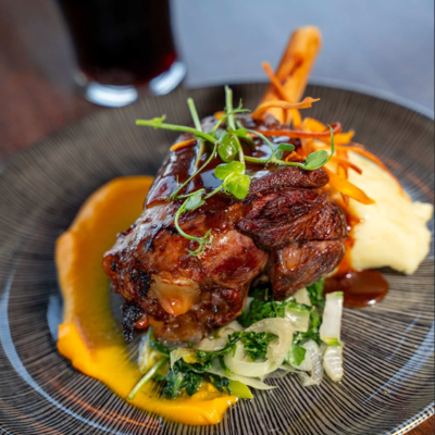  a slow-cooked lamb shank served with creamy mashed potatoes at Rine Hotel Co Clare
